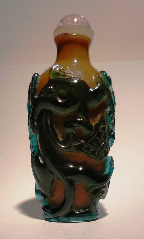Overlay glass snuff bottle with green chilong on caramel ground